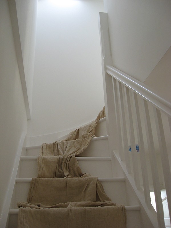 A painted softwood single turn three winder staircase for a loft conversion.