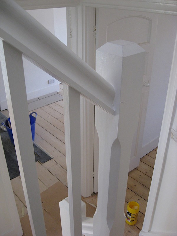 A painted softwood single turn three winder staircase for a loft conversion.