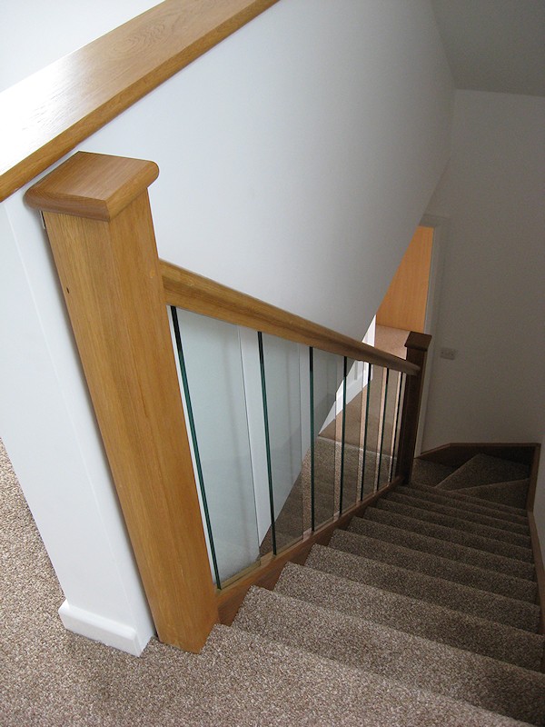 A clockwise single turn, three winder staircase in oak construction.