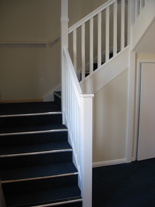 Two softwood painted stairs designed for high traffic usage.