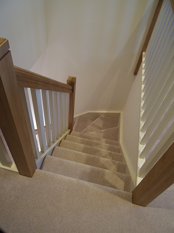 A softwood single turn winder staircase for a loft conversion.