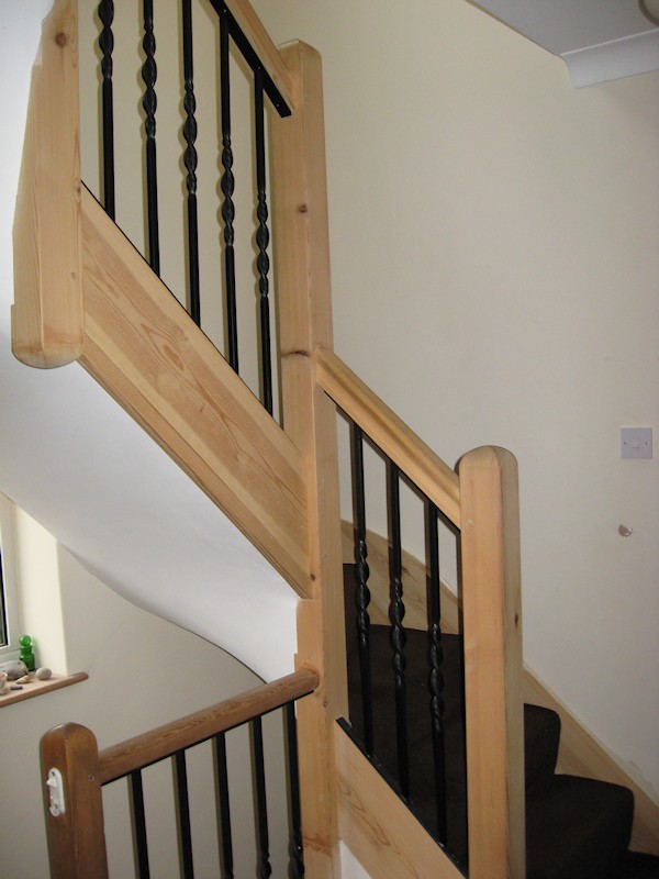 A softwood double turn winder staircase for a loft conversion