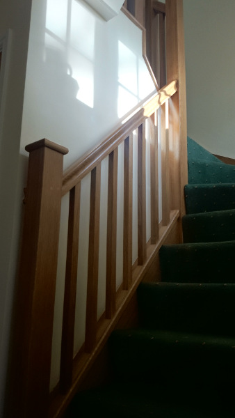 Oak construction staircase including our std handrail, square spindles and flat newel caps.