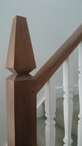 A very unique staircase, just look at those newel tops!