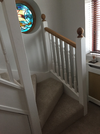 Loft conversion winder staircase using Georgian turned spindles.