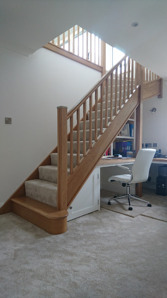 Oak winder staircase using our crown profile handrail.